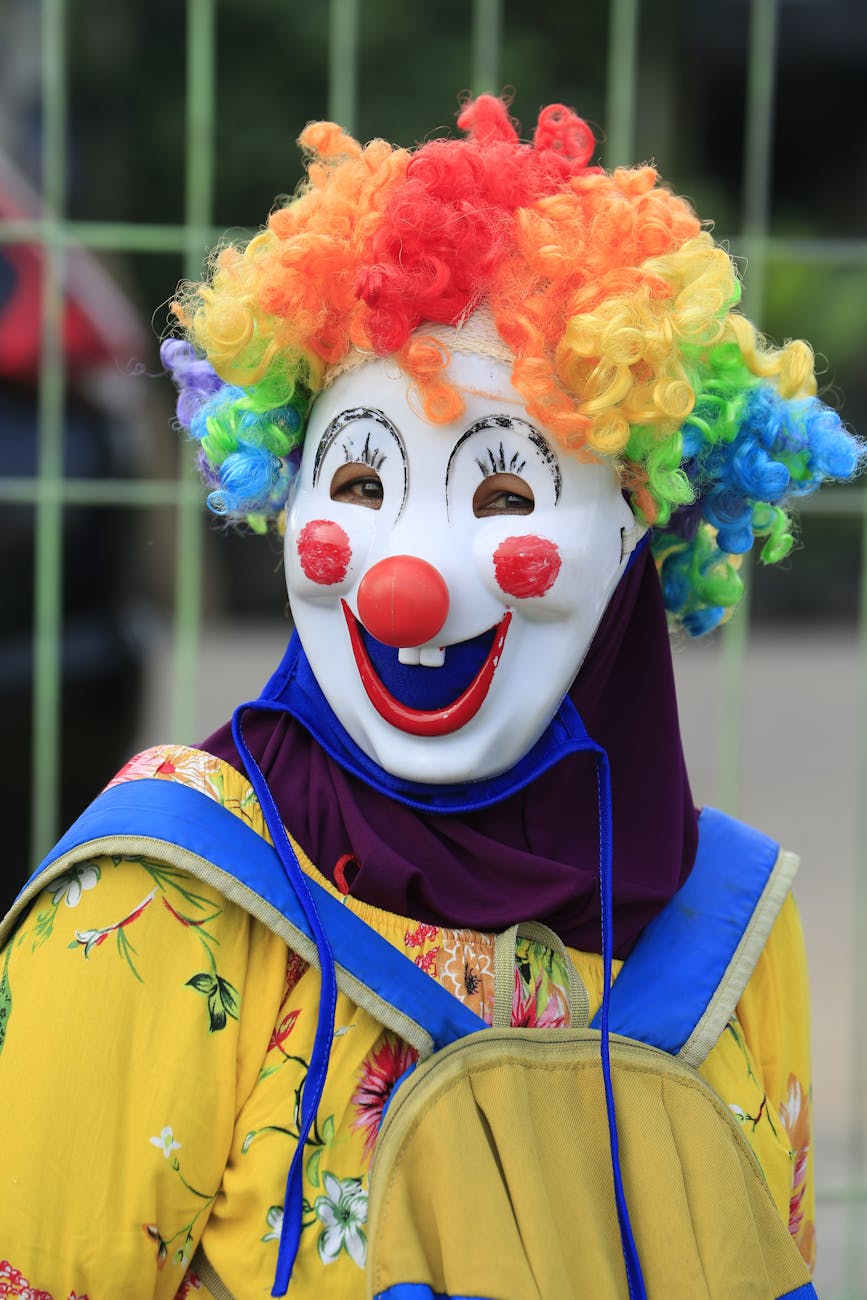 a clown carrying a backpack in front