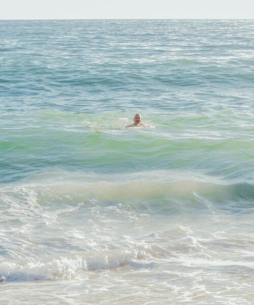 a man swimming in sea water